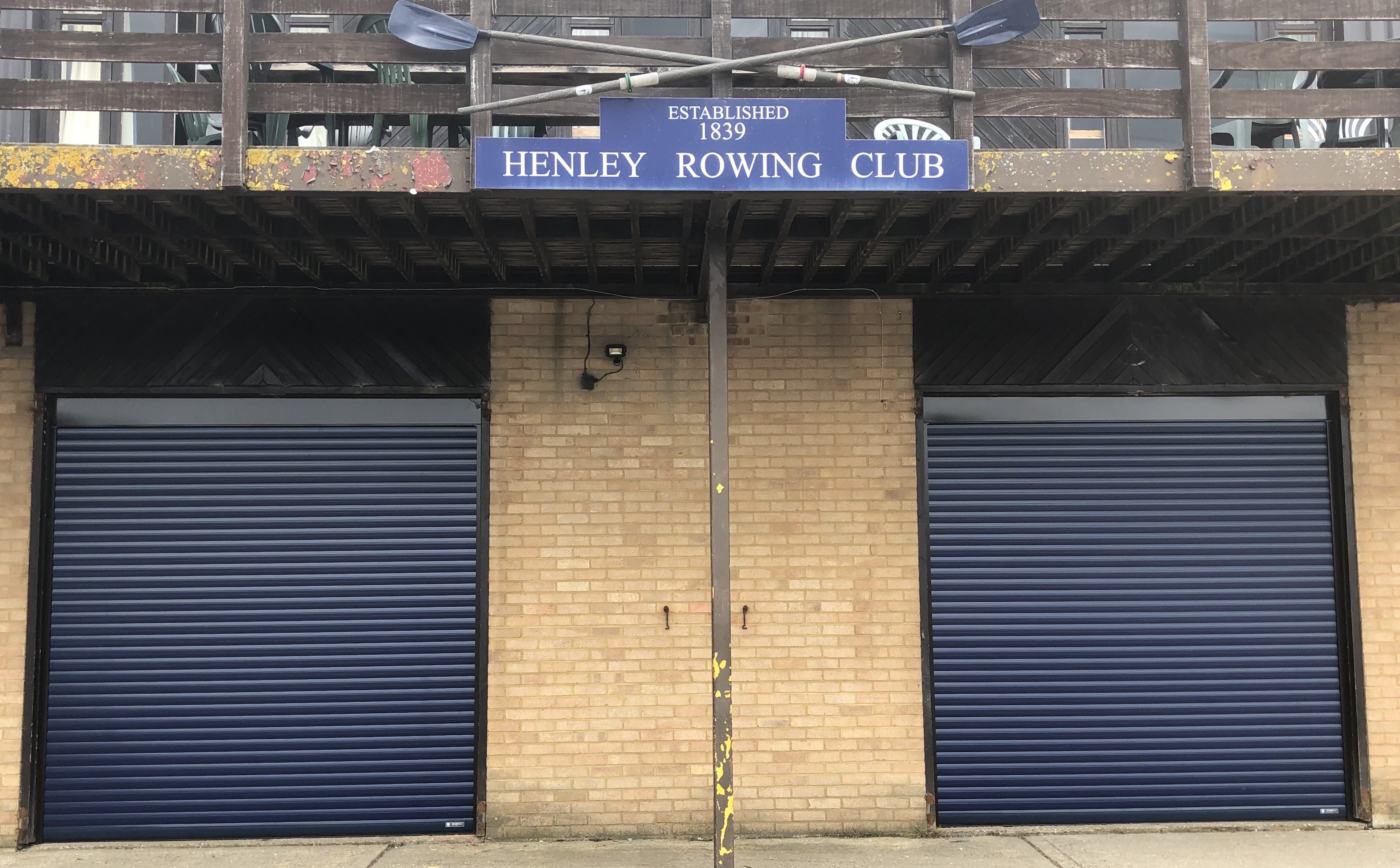 Aluroll insulated roller shutters in Steel Blue installed on a Henley Rowing Club